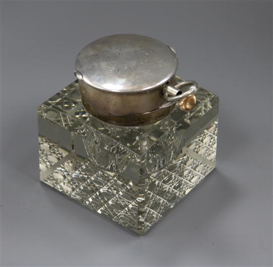 An Edwardian silver mounted cut glass combination inkwell/pocket watch holder, John Collard Vickery, London, 1903, height 11.1cm.